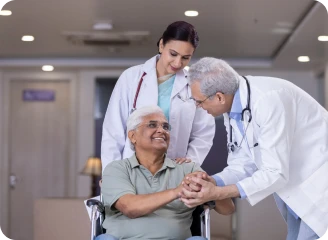 Oncologist holding hands with a patient.